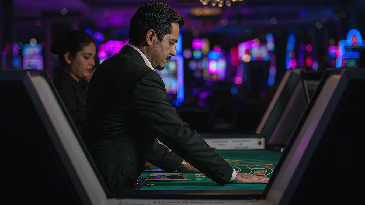 Man beside a roulette table — Elon Casino